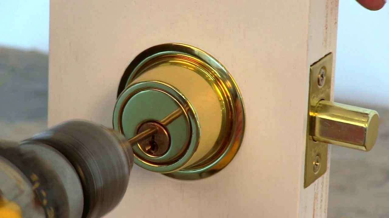 The lock mechanism on a regular door works simply: A metal piece moves in and out of a hole or notch in the door frame when someone turns the handle. When you've locked the handle, the metal piece doesn't move, and the door won't open. Do not worry we will give you tips today and tell you How to open a lock door. A simple catch provides more security than a door handle lock. But all you have to do is make the metal move out of the way and the door will open easily. This can be done by inserting a credit card between the metal and the door frame. You can prevent credit card entry in several ways. Educate yourself on how a lock can be bypassed with a credit card. By understanding how it works, you can take steps to prevent it in the future. See the Resources section for a short video demonstrating how a credit card can be used to open your lock. Install a door latch guard. This metal plate follows the contour of the door frame, extending over it. It is designed to prevent someone from sliding a credit card into the space between the door and the frame. Use a dead bolt on your door. A dead bolt is a much longer piece of metal—or bolt—that is inserted far into the door frame, whereas a door handle lock only uses the small piece of metal that can be moved with a credit card. Install additional dead bolts on your door for extra security. Add a sliding door latch to your door. Similar to a dead bolt, a sliding door latch, with its long metal bar, cannot be moved out of the way by a credit card. Install an electronic door handle on your outside doors. These locks have keypads that require a code to be punched in to gain entry. There is not a space to slide a credit card into these locks. TIP Do not rely on the door handle lock by itself. The way these locks are set up make it easy for someone to slide a card through the door frame and bypass the lock in a matter of seconds.